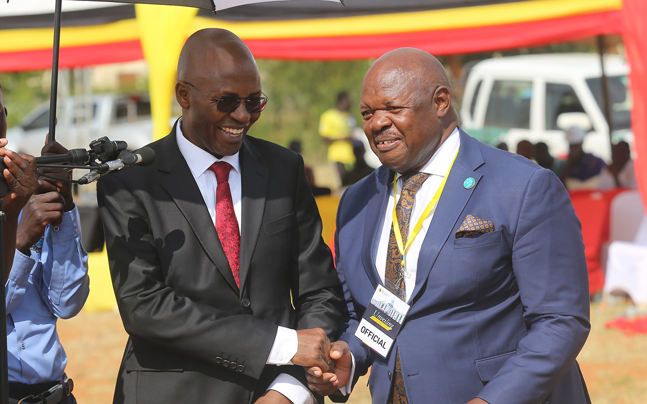 Counsel-Twinobusingye-Severino-Shakes-Hands-with-Senior-Counsel-John-Mary-Mugisha